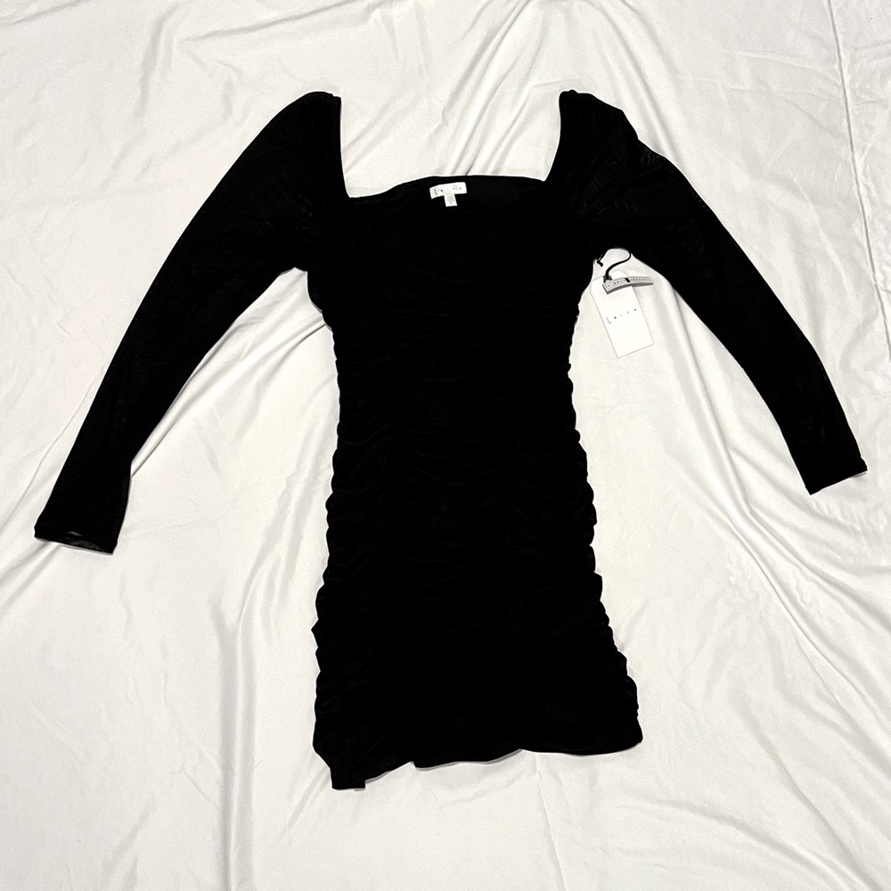 Little black dress. Brand New. Ruched with Sheer long sleeves.
